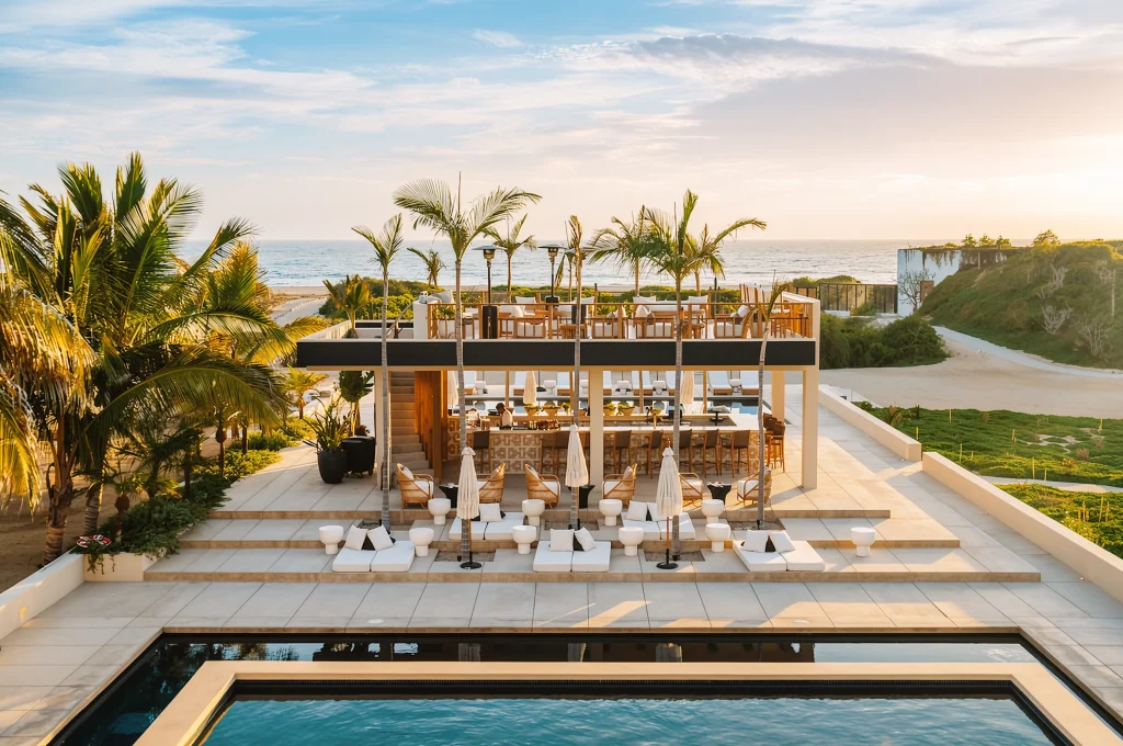 A beachfront hotel pool among the palms on the Pacific coast
